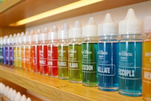 A colorful assortment of different vape e-liquid bottles showcasing various best vape flavours.