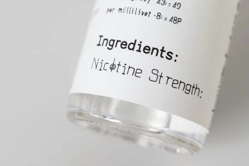 Close up of an e-liquid bottle label showing ingredients and nicotine strength, important for high nicotine vapes AUS quality checks.