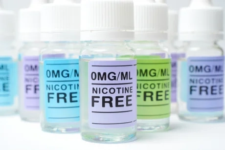 Clearly labeled e-liquid bottles showing nicotine-free content