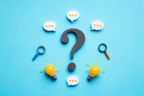 A large question mark icon surrounded by chat bubbles, representing frequently asked questions about Australian online vape stores.